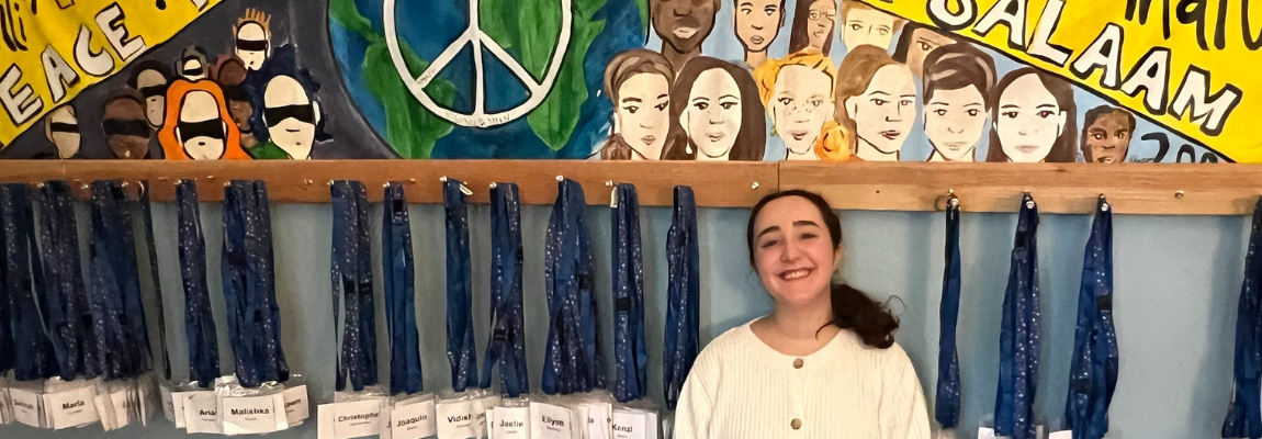 Student in front of Charter Oak Banner